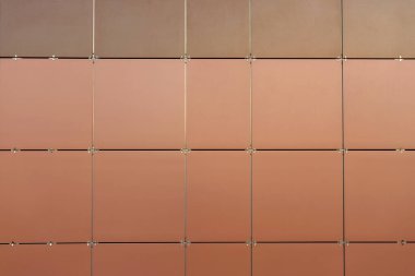 Duvar kahverengi renkli renkli renkli seramik fayanslarla kaplı. Minimalizm, arka plan