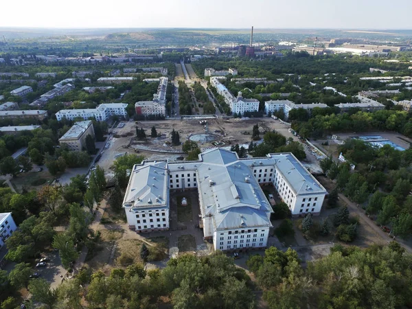Aerial view of on reconstruction of the fountain and central square of the city and Palace of Culture of Kramatorsk - the administrative center under control to the Ukrainian government, not occupied part of Donetsk region.