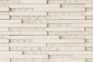 Granite tiled wall detailed pattern texture background in natural light creme beige color clipart