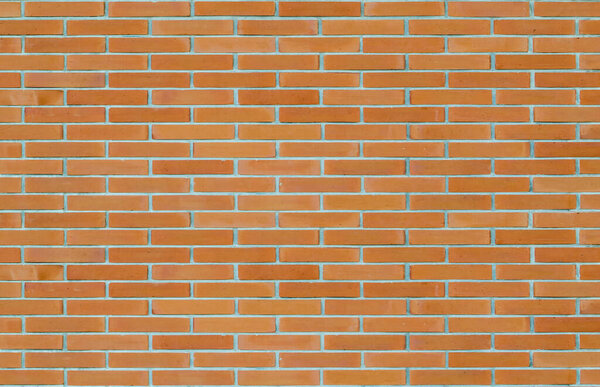 Brick wall texture pattern background in natural light ancient red orange brown color 