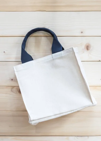 Mockup tote bag fabric cloth shopping sack on white wood