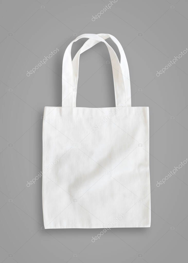 Tote bag mock up canvas fabric cloth shopping sack on grey background isolated with clipping path 