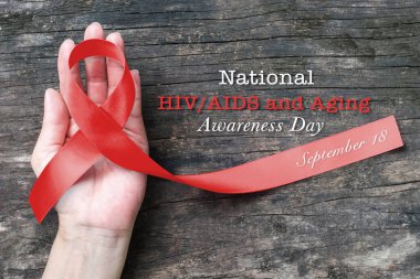 Ulusal HIV / AIDS ve kırmızı kurdele sembolik ikonu ile yaşlanma farkındalığı günü