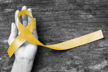 Sarkoma Kemiği kanseri için sarı kurdele sembolik rengi, Spina Bifida Farkındalık Ayı ve yardım eli üzerinde intihar önleme (kırpma yolu ile izole edilmiş))