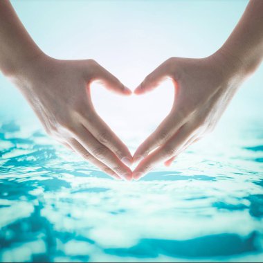 World water day concept with hands in love heart shape concept clipart