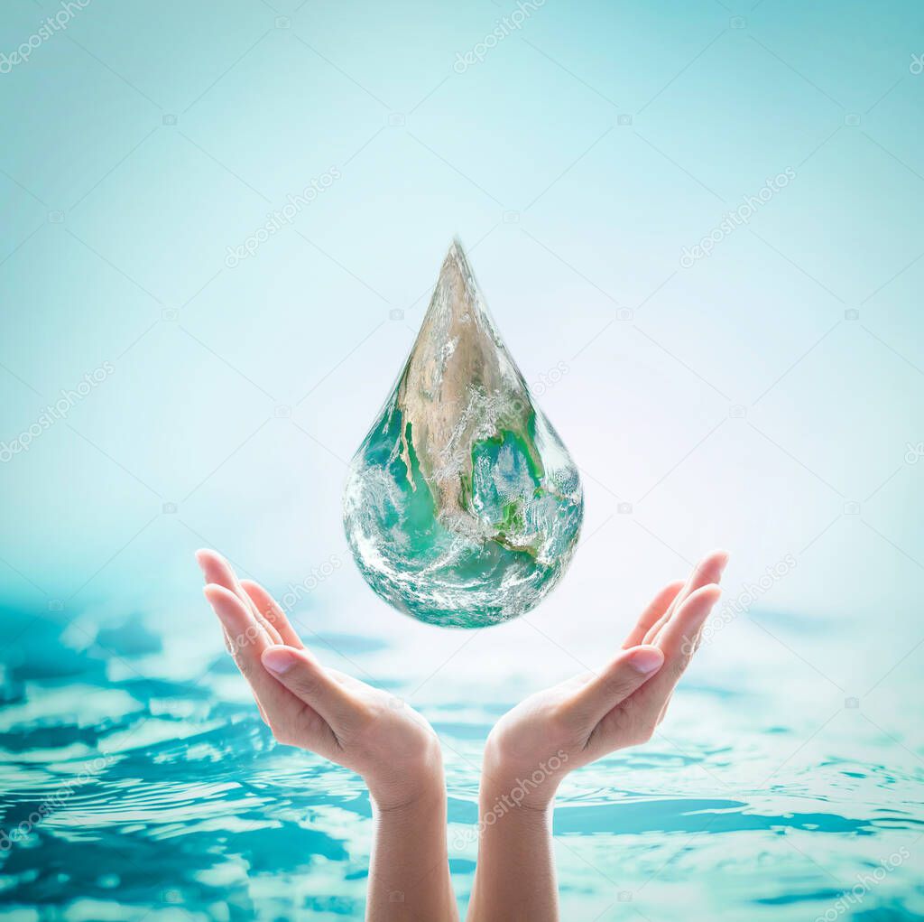 World ocean day, saving water, environmental protection, sustainable ecological ecosystems concept with green earth drop on woman's hands on sea background: Element of this image furnished by NASA 