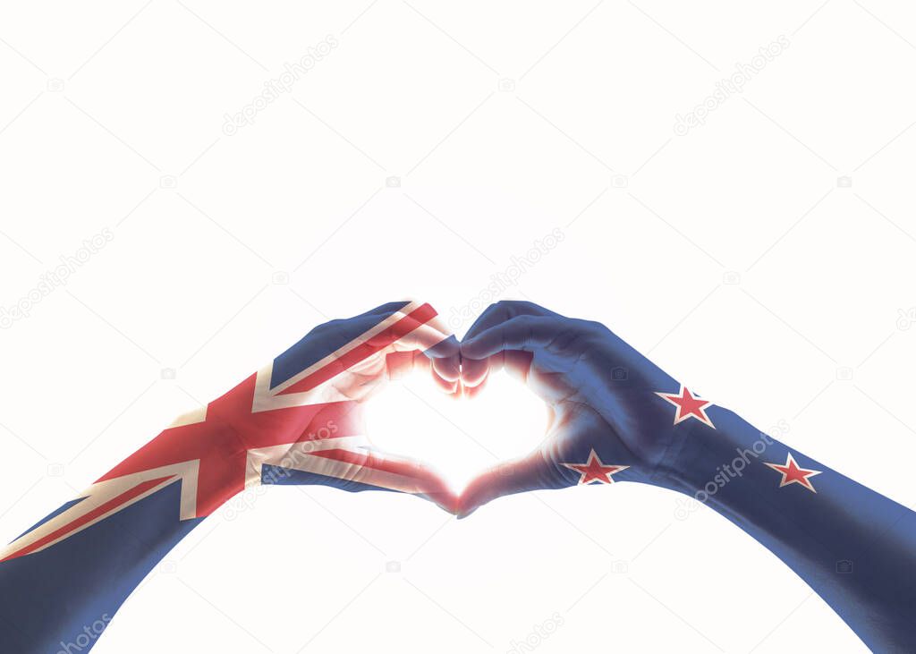 New Zealand flag on people heart shaped hands isolated on white background (clipping path) for NZ national public holiday celebratio