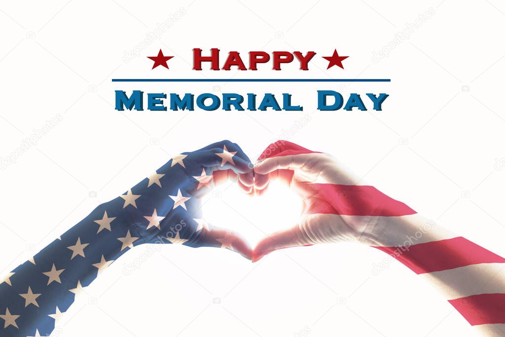 Happy memorial day with America flag pattern on people hands in heart shape