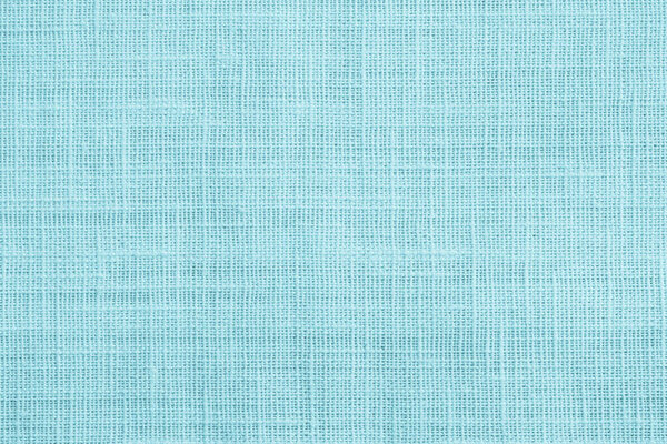 Jute hessian sackcloth canvas sack cloth woven texture pattern background in teal cyan blue color