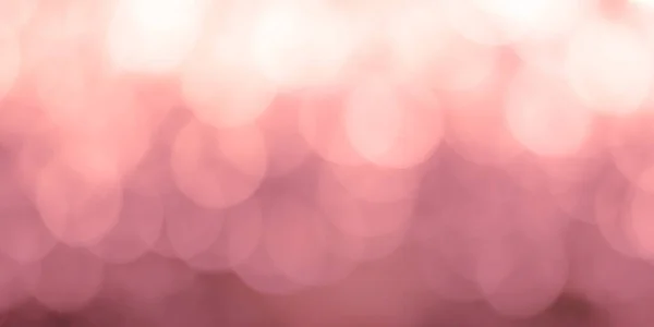 Bokeh模糊了抽象的背景 模糊的灯光闪烁着粉色玫瑰色的光芒 — 图库照片