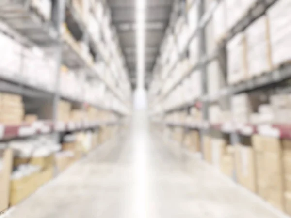 Warehouse industry blur background with  logistic wholesale storehouse, blurry industrial silo interior aisle for furniture merchandise inventory and wood material, construction supplies big box store