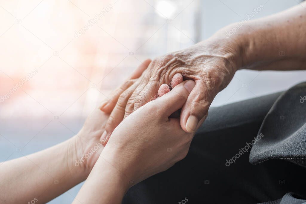 Parkinson disease patient, Alzheimer elderly senior, Arthritis person hand in support of nursing family caregiver care for disability awareness day, National care givers month, ageing society concept