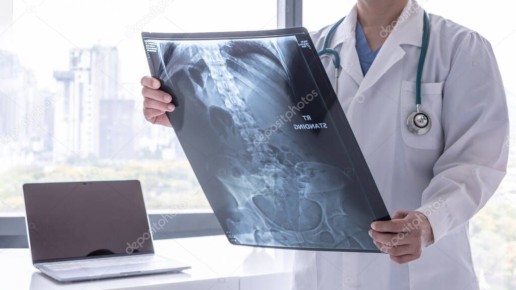 Stomach x ray film image with doctor for medical and radiological diagnosis on female patients health on abdominal disease and bone cancer illness, healthcare hospital service concept