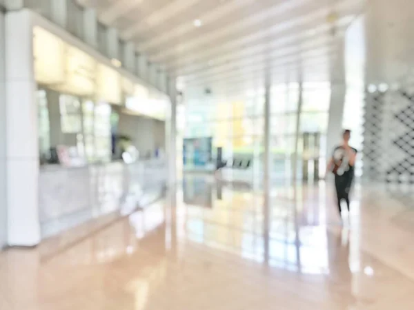 Business office lobby blur background of bank reception hall customer or patient counter service and cashier desk inside blurry hospital, office or hotel waiting hall with glass wall window