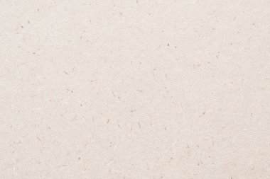 Parçacık tahtası, yonga arkaplanı parçacık baskısının bulanık desenli ahşap panel veya açık bej kahverengi sepia rengi OSB tablosu