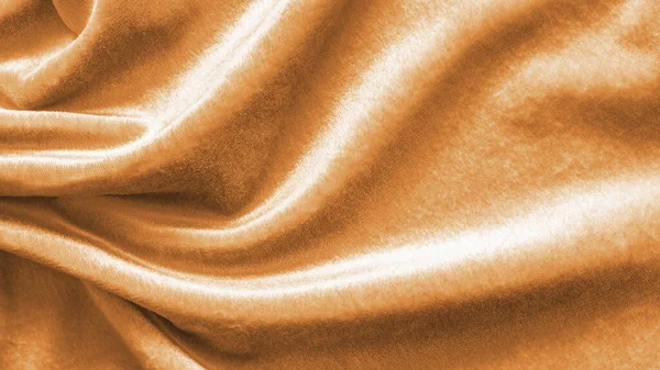 柔らかいふわふわベルベットサテン生地の金属色の素材で綿やウールで作られた銅ゴールドベルベットの背景や黄金の黄色のベロアフラネルテクスチャ — ストック写真