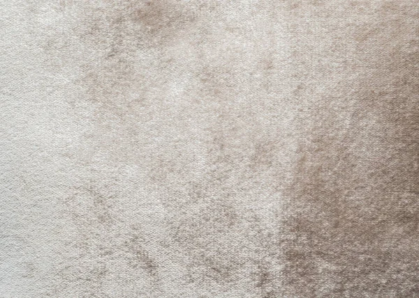 柔らかいふわふわのベルベットサテン生地で綿やウールで作られたベージュベルベットの背景やベロアフランネルテクスチャ金属色の素材 — ストック写真