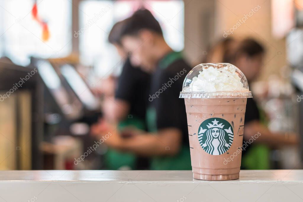 BANGKOK, THAILAND - January 14, 2017: Starbucks coffee cold beverage on table, famous coffee brand franchise originated in USA