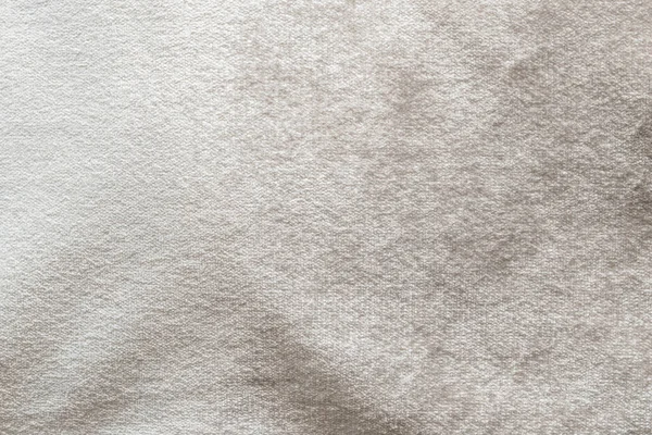 柔らかいふわふわのベルベットサテン生地で綿やウールで作られたベージュベルベットの背景やベロアフランネルテクスチャ金属色の素材 — ストック写真