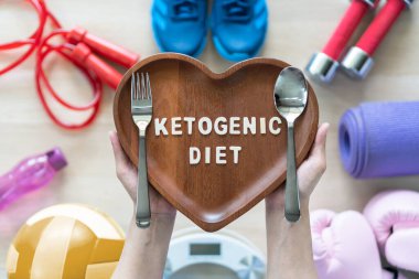 Ketogenic diet concept with intermittent fasting for weight loss, keto food eating, meal skipping with exercise lifestyle and to prevent heart disease and illness clipart