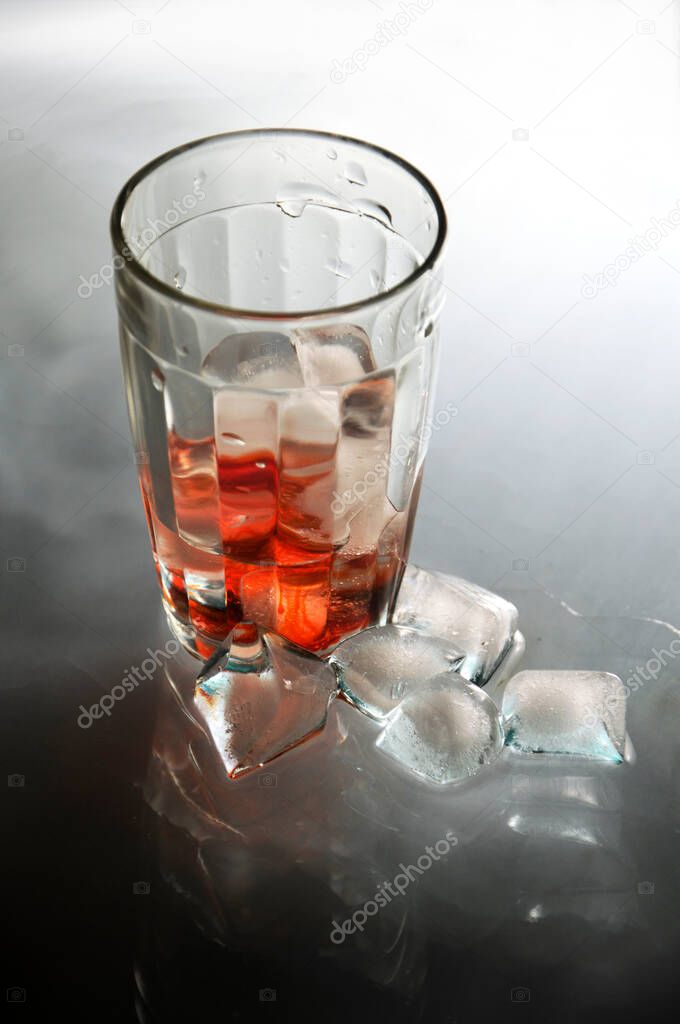 glass of soda water with Ice cubes