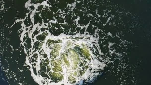 Close up aerial drone shot over a treatment basin with bubbles coming up — Stock Video