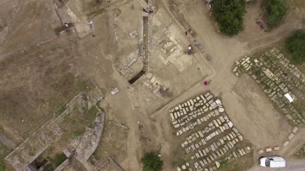 Roman monumental area archaeological site overlooks Montpellier garrigue aerial — Stock Video