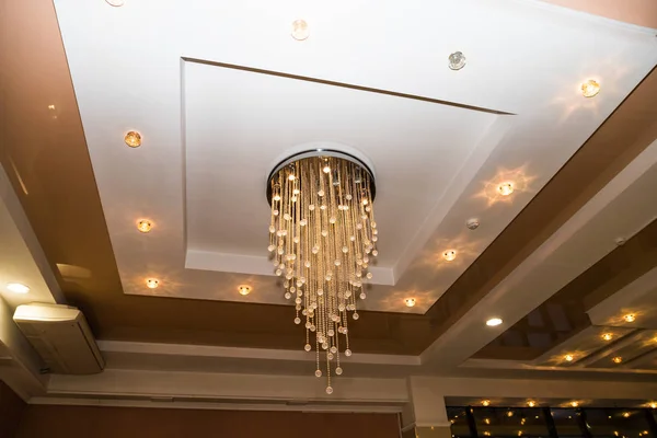 Crystal Chandelier on the beautiful white ceiling with lights