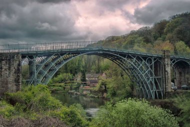 The Iron Bridge in Shropshire was is the world's first bridge made from cast iron in 1781. clipart