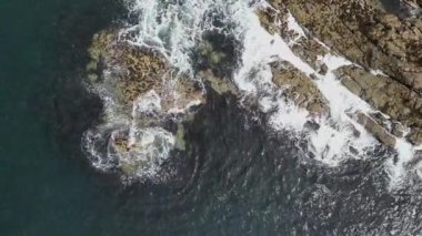 4K drone footage of the rocky coast at the north of the Isle of Coll in Argyll and Bute, Scotland