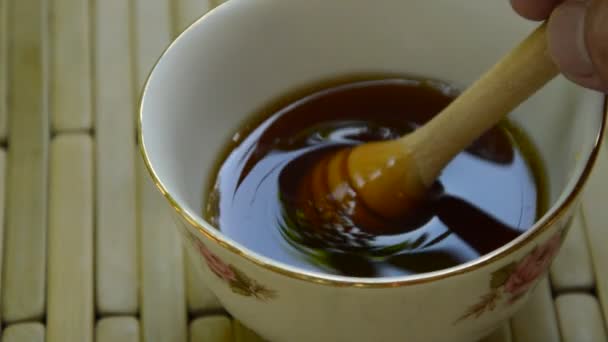 Hand Picking Wooden Honey Scoop Cup — Stock Video