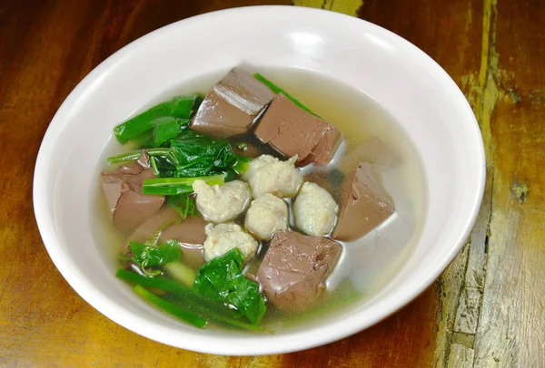Boiled pork blood with vegetable gourd and minced pork soup on bowl — Stock Photo, Image