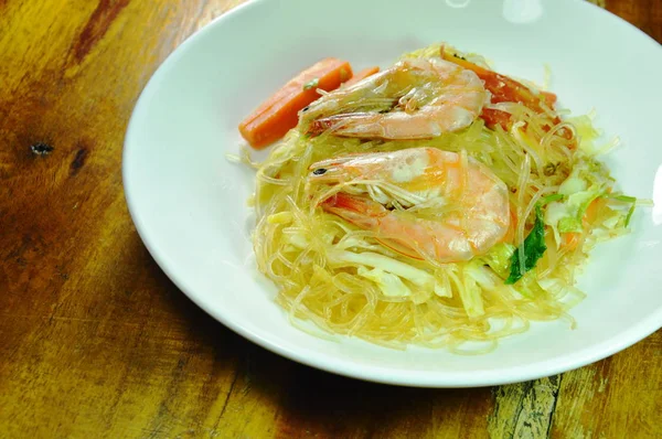 Stir fried glass noodles with cabbage and egg topping shrimp on white plate — Stock Photo, Image