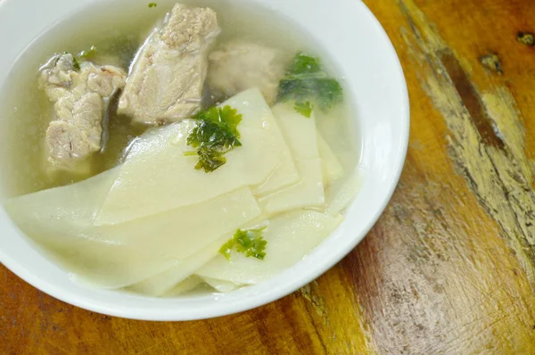 Boiled slice bamboo shoot with pork bone soup on bowl — Stock Photo, Image