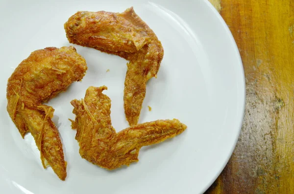 Crispy fried chicken wing with herb on white plate — Stock Photo, Image