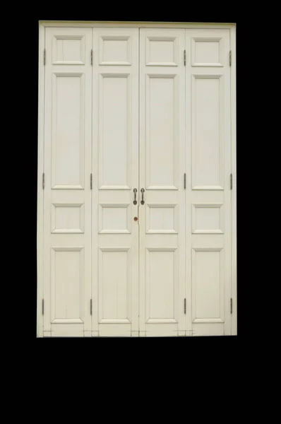 老和古董木白色门被隔绝在黑色背景上 — 图库照片