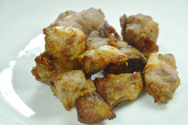 fried fermenting pork bone on white plate