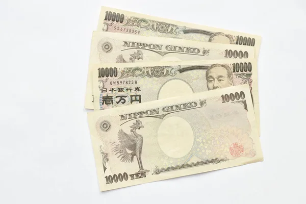 흰색 배경에 일본 엔 지폐 — 스톡 사진