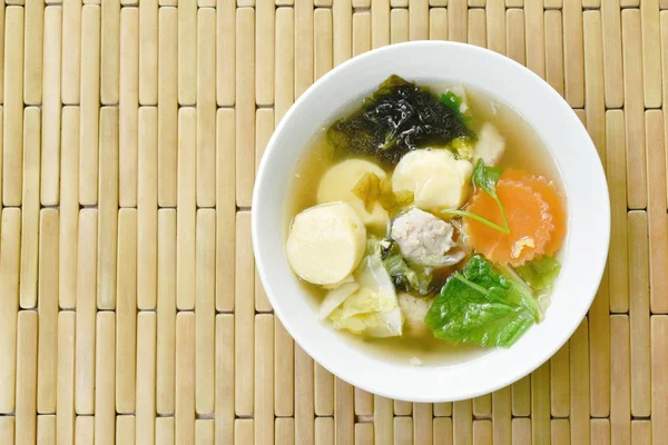 boiled egg tofu with minced pork and cabbage topping seaweed soup on bowl