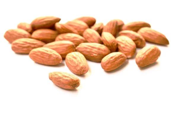 Baked almond seed batch on white background — Stock Photo, Image