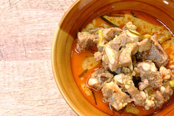 Boiled pork bone with coconut milk curry on bowl — Stock Photo, Image