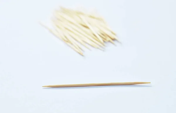 Wooden toothpicks arranging on white background — Stock Photo, Image