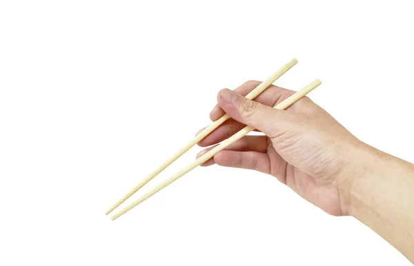 手持和使用白色背景的木制筷子 — 图库照片