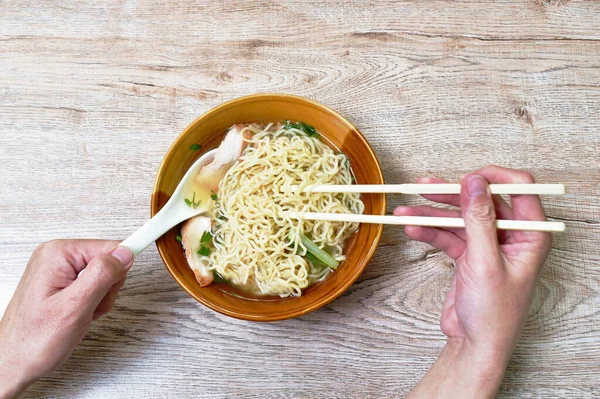 Hand Holding Chopsticks Picking Chinese Yellow Egg Noodles Topping Slice — Stock Photo, Image