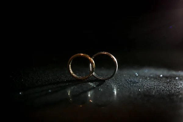 Wedding Rings Glass Stock Image