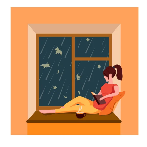 Egy lány ül az ablaknál, könyvet olvas és teát iszik, miközben esik az eső az ablakon kívül. — Stock Vector