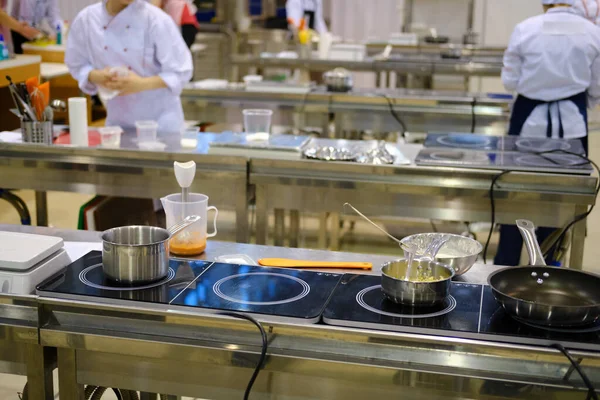 Large kitchen in the restaurant with many chefs