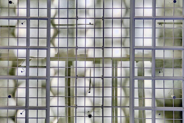 Background in the form of a glass ceiling, technical design in an industrial building