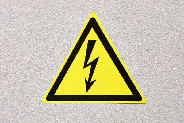 Yellow electrical hazard sign. Danger symbol with electric lightning