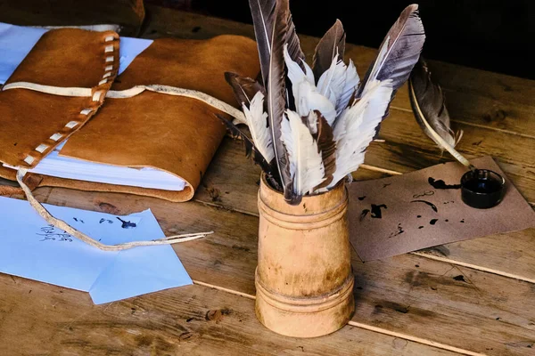 Vintage letter writing set. Feathers and ink for writing in retro style.